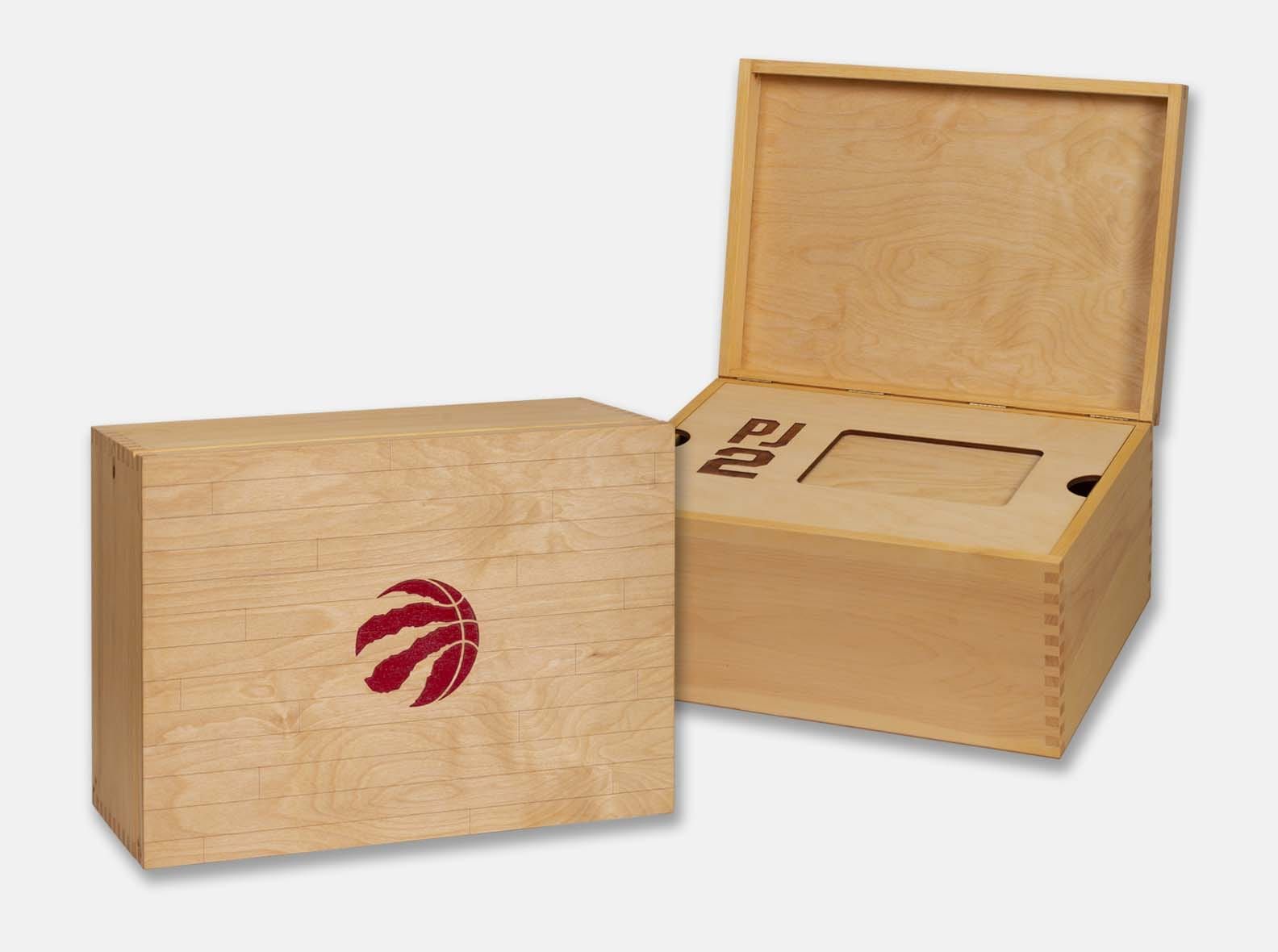 Raptors custom box to hold iPad and player's shoes. Box joint construction. Lid engraved to resemble basketball court. Red paint inlay