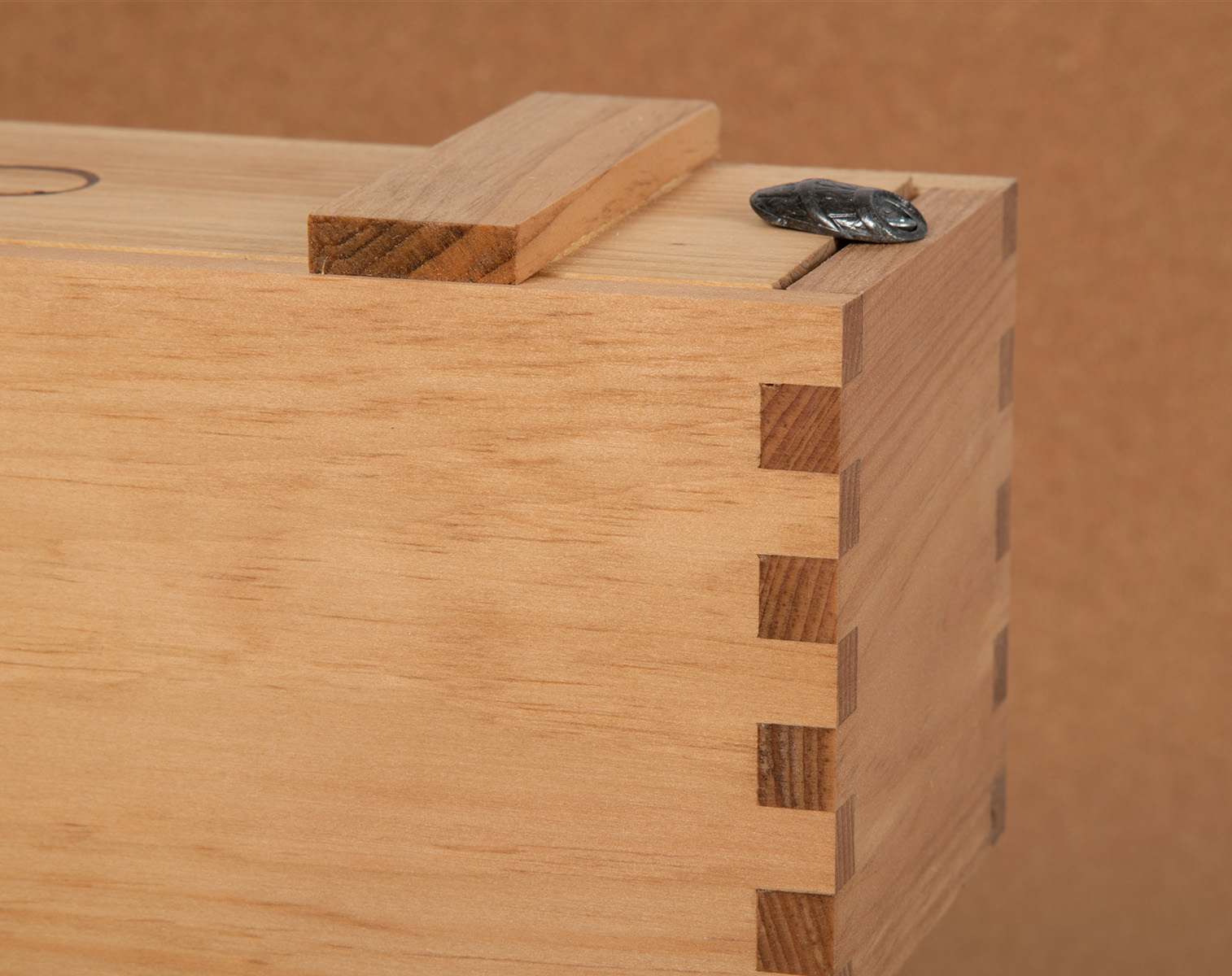 Close-up of box-joint construction on a custom wood box.